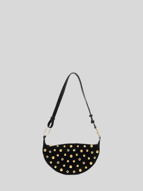 Black handbag with gold studs on a light gray background